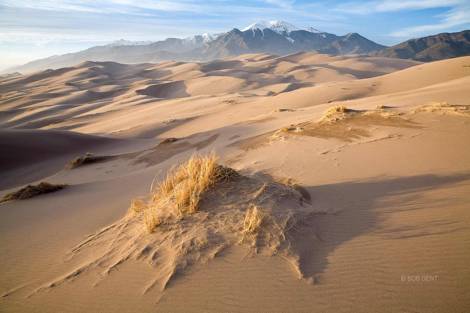 Strong winds blow across the sand dunes at the foot of the Sangre De Cristo Mountains at sunset, Great Sand Dunes National Park...