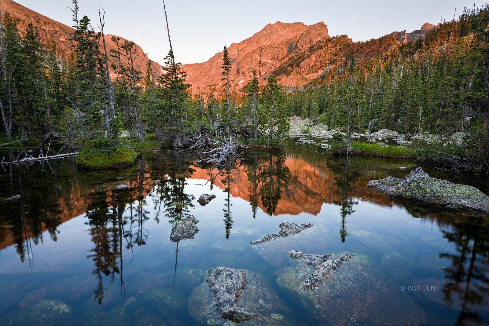 Hallett Peak Alpenglow Sunrise paints Hallett Peak red near Lake Haiyaha, Rocky Mountain National Park, Colorado.