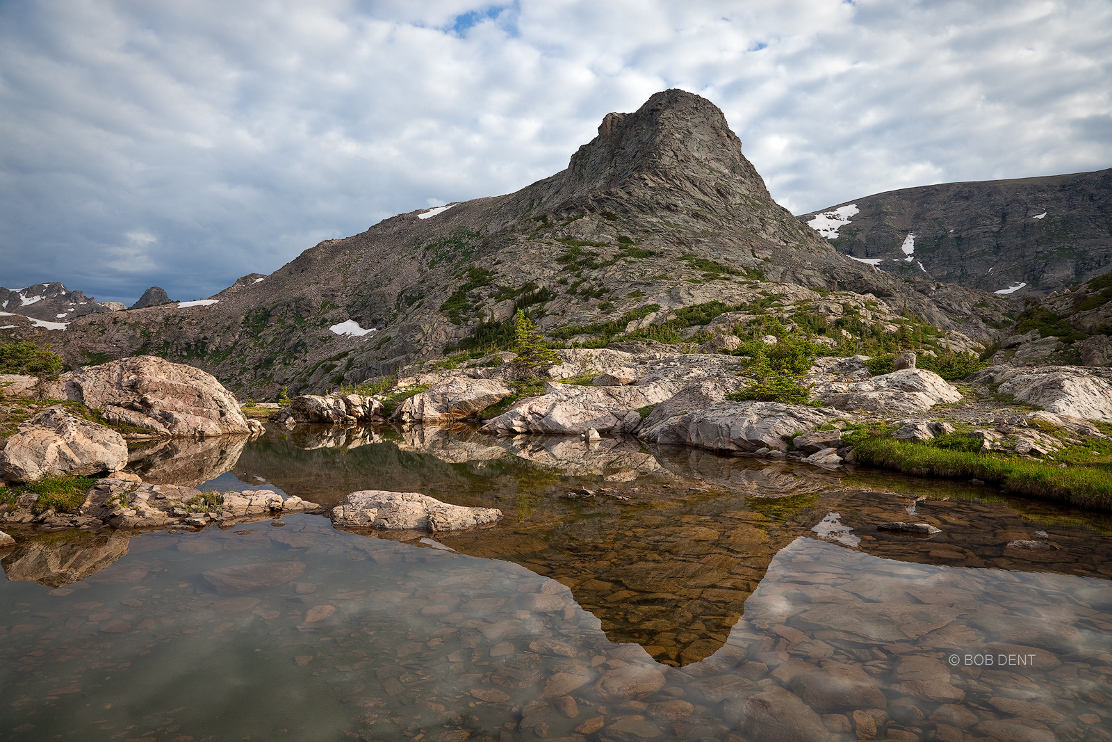 Cooper Peak reflecting in an alpine pool at sunrise. Indian Peaks Wilderness, Colorado.