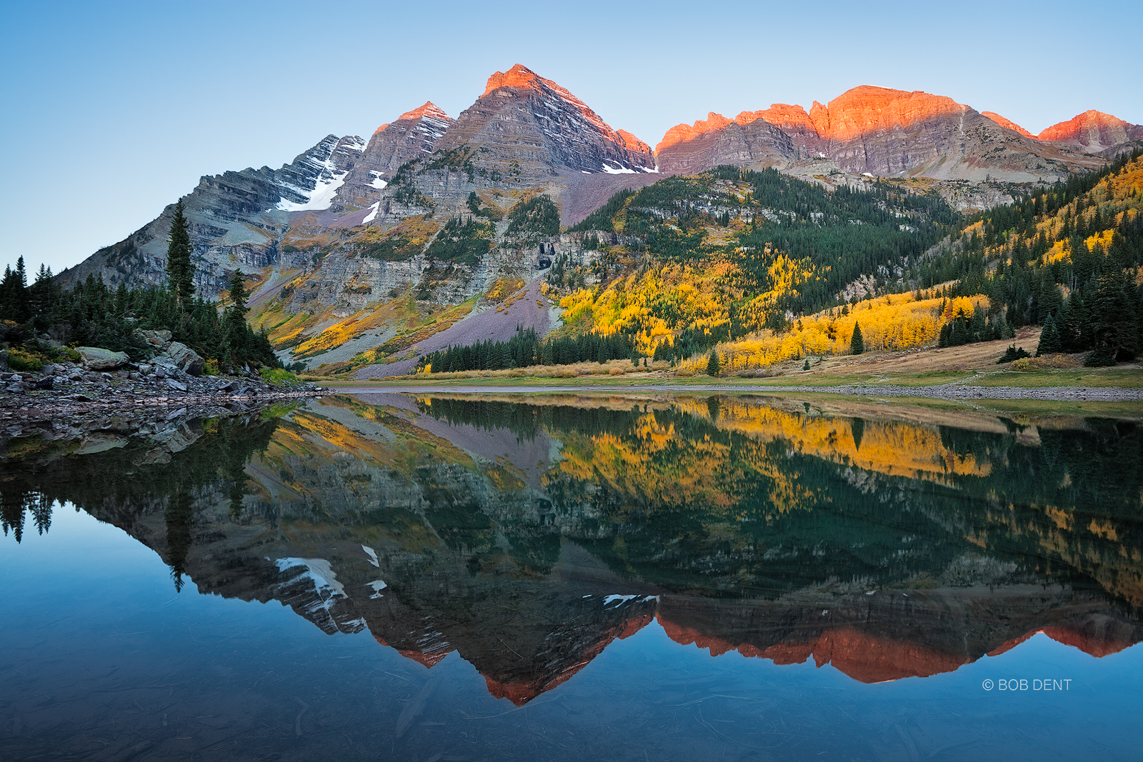 Crater Lake Sunrise The Maroon Bells reflecting in Crater Lake at sunrise, Maroon Bells Snowmass Wilderness, Colorado.
