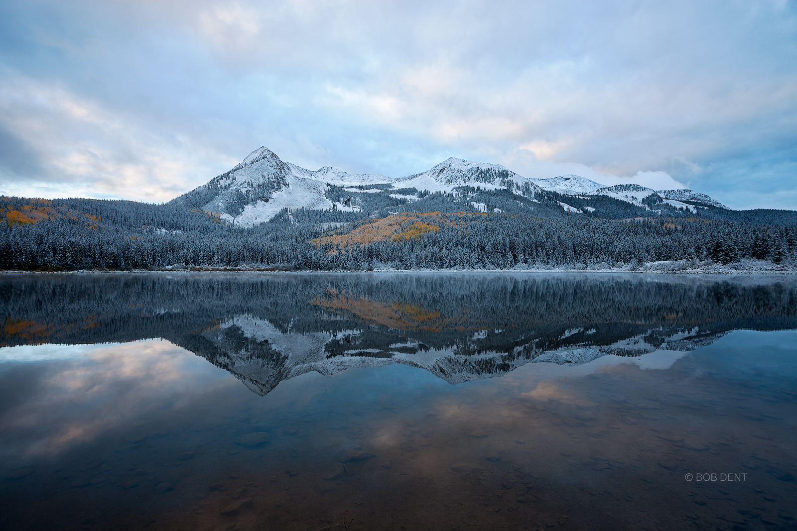 Lost Lake Slough East Beckwith Mountain reflecting in Lost Lake Slough on a cold and snowy autumn morning.