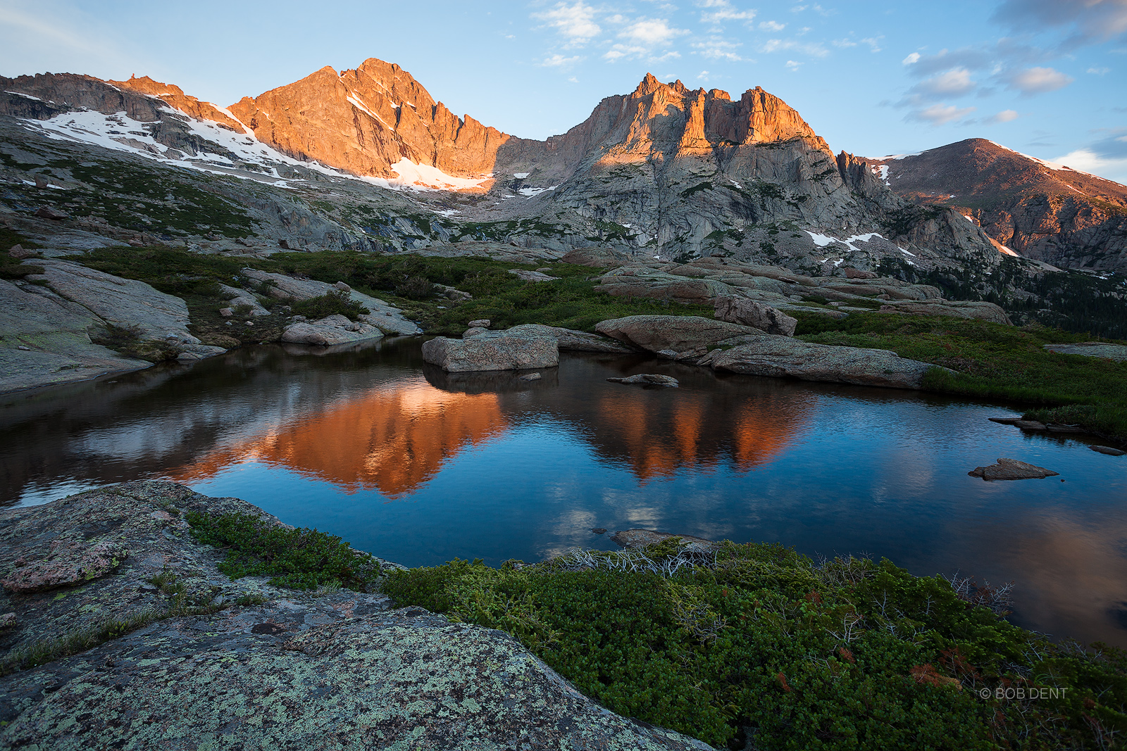 McHenry's Peak and Arrowhead reflecting in an alpine pool at sunrise.