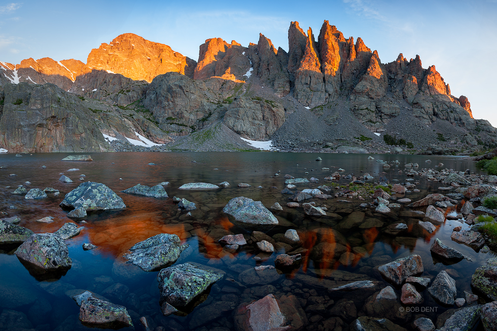 An expansive view of Sky Pond at sunrise.